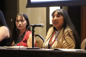 Alysia Coriz Kewa of Pueblo, at Native American Summit with New Mexico Governor, May 2023. UNM Alumna.jpg.